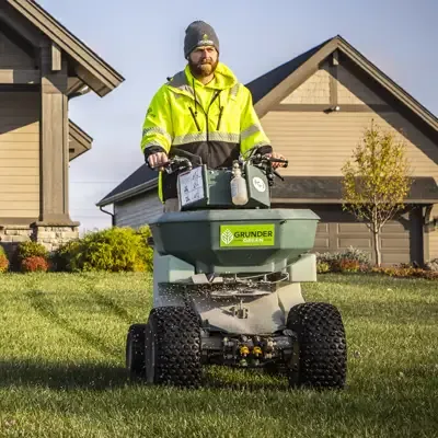 Grunder Green Lawn Technician Fertilizing Lawn