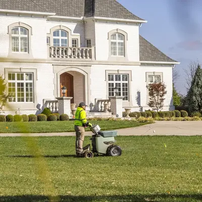 Grunder Green Lawn Technician Fertilizing Lawn